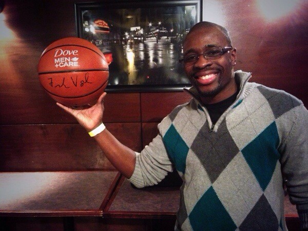 Melvin Guinn with his Dove Men + Care basketball signed by the Indiana Pacers head coach Paul Vogel.